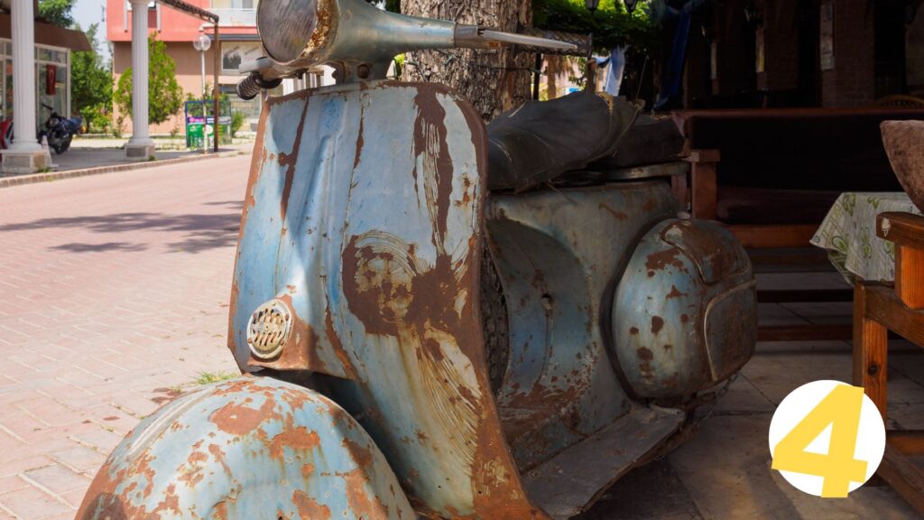 rusty blue scooter